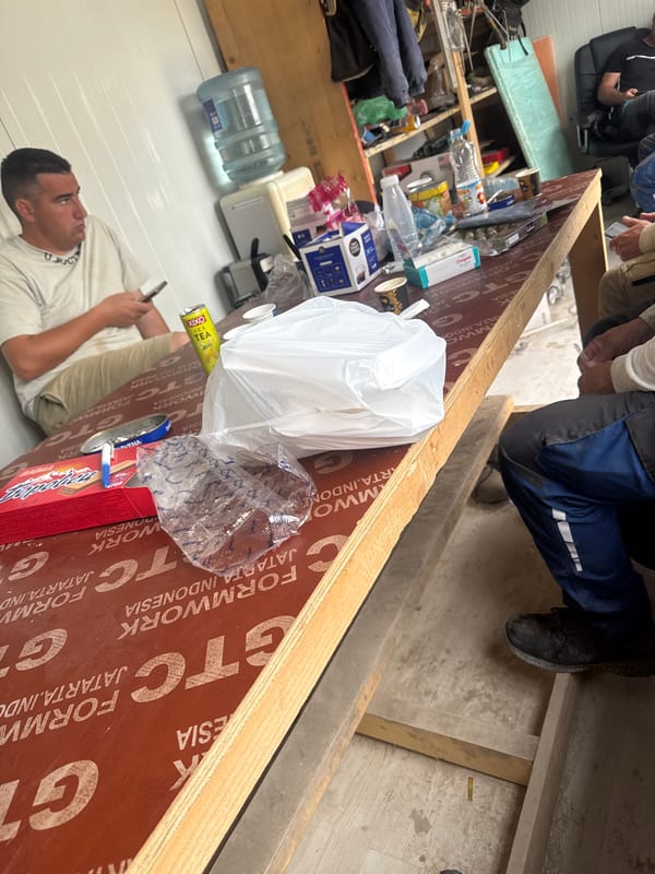 Person uses phone in cluttered indoor space in Plovdiv