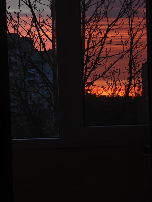 Sunset observed through windows and cityscape in Hrodna, Belarus