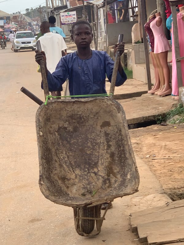 Everyday street life in a busy Abuja marketplace