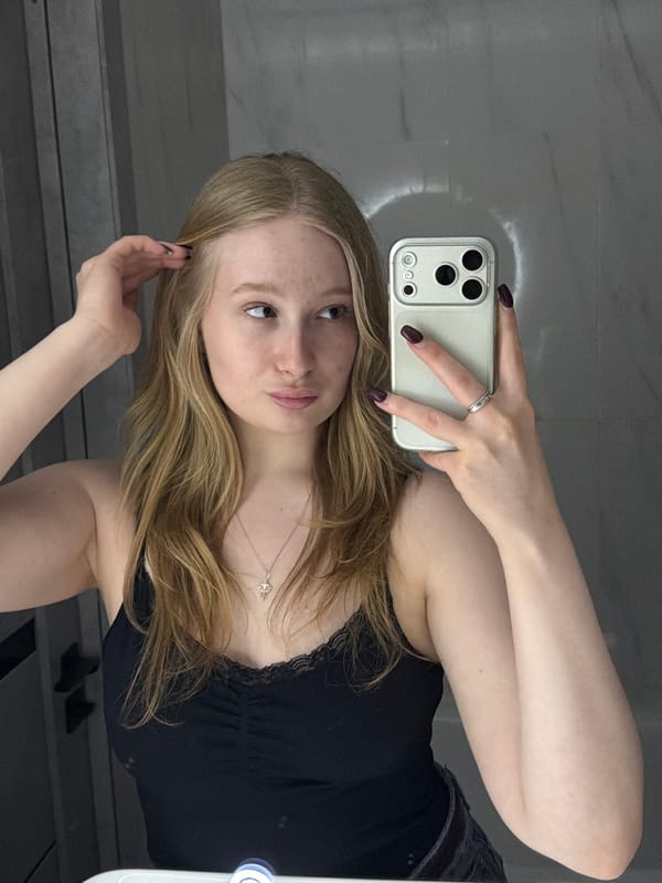 Woman takes mirror selfie in Yuzhny, Russia