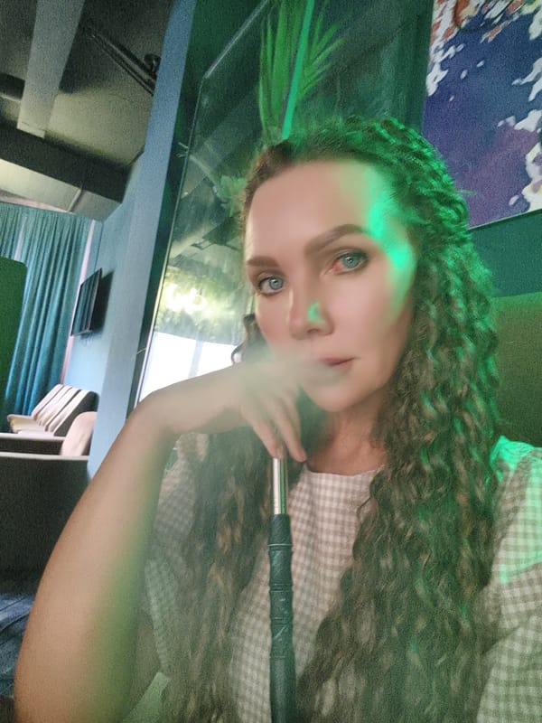 Evening out at a neon-lit hookah lounge, multiple selfies