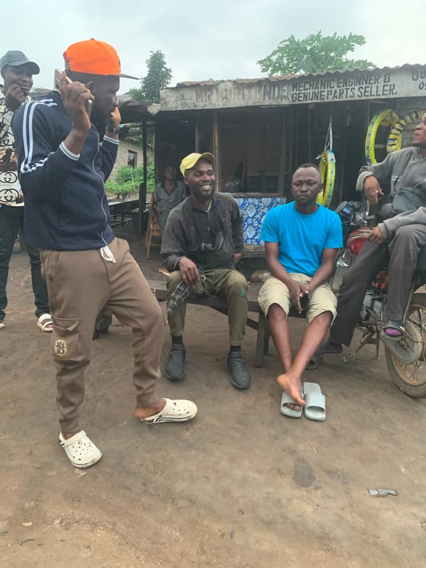 Everyday street life around a Shagamu motorcycle mechanic strip