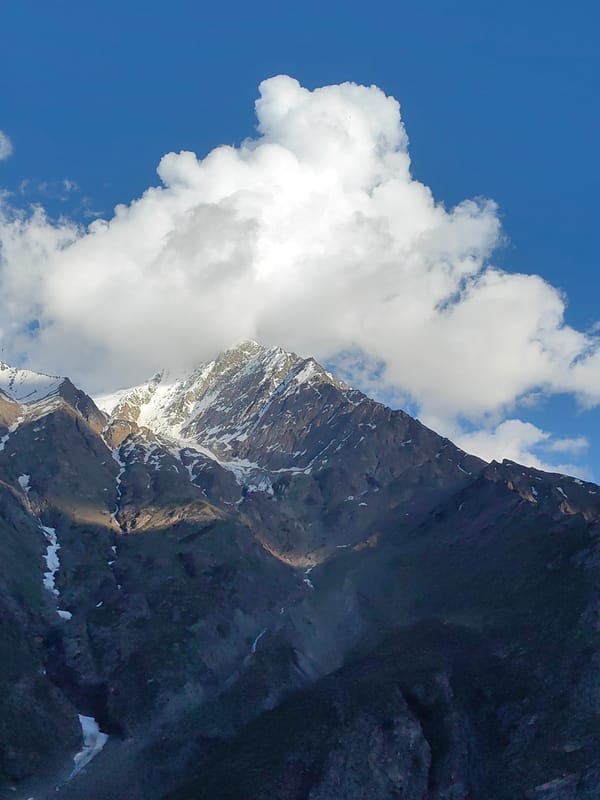 Snow-capped Himalayan peaks and roadside scenes in Kead, India