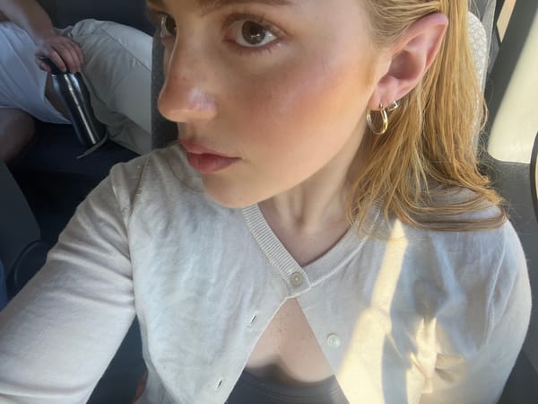 Woman takes selfies in vehicle in Livingstone, Zambia