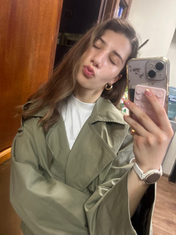 Selfie series in a Ruse office, olive jacket and gold hoops