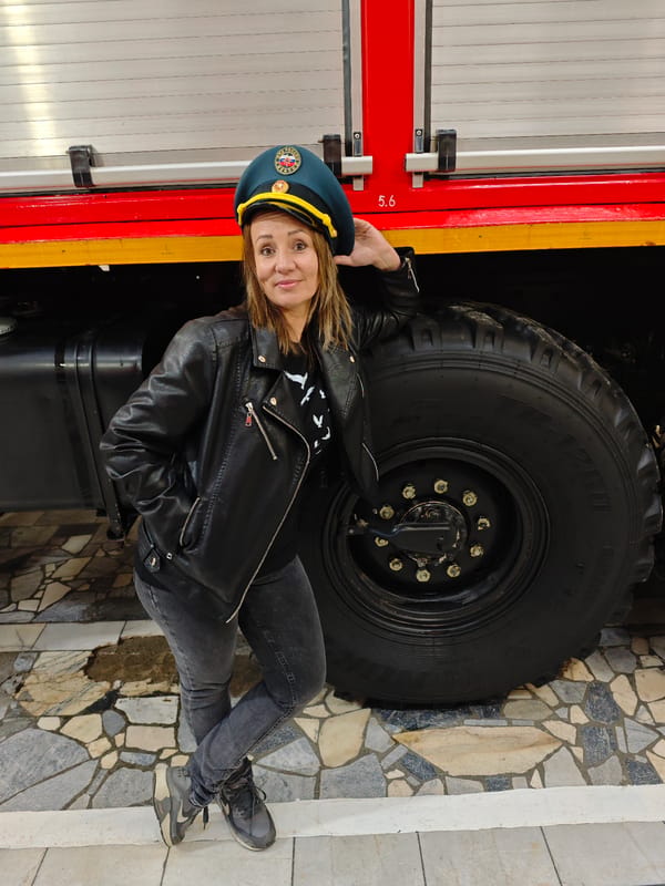 Emergency services worker poses with vehicle in Dubovaya, Russia