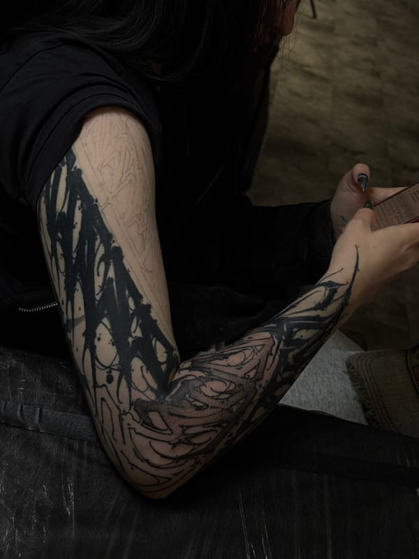 Moscow indoor scenes: tattoo work, furniture, camera gear documented