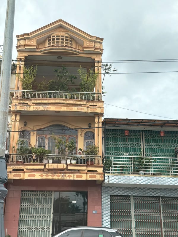 Mixed streetscape and temple architecture along Huế's urban wards