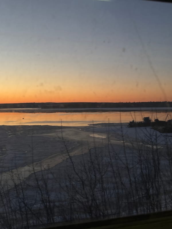Sunset and train passengers captured in Perm, Russia