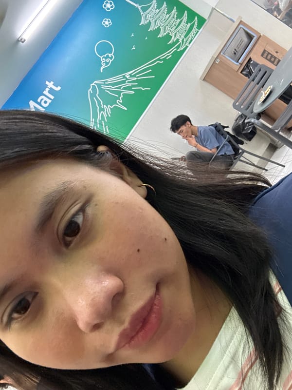 Selfie session at an East Jakarta indoor spot with a mural backdrop