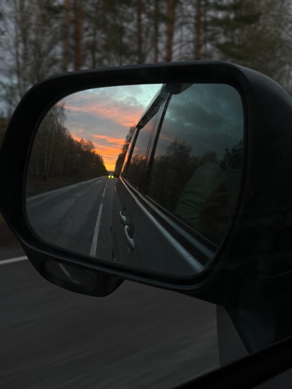Evening drive captured in car mirror near Urten', Russia