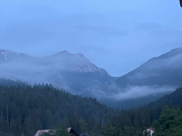 Mountain village evening: hillside views, twilight skies, scattered indoor moments