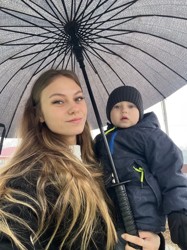Woman cares for toddler during early morning in Russia