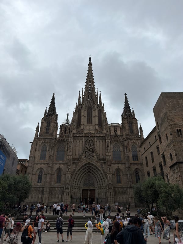 Tourist explores Barcelona Cathedral and Gothic Quarter on overcast afternoon