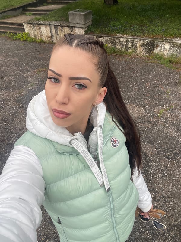 Woman takes selfies by car in Veliko Tarnovo