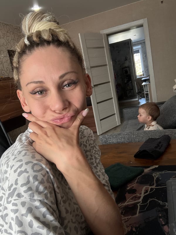 Woman and toddler captured in quiet domestic moment