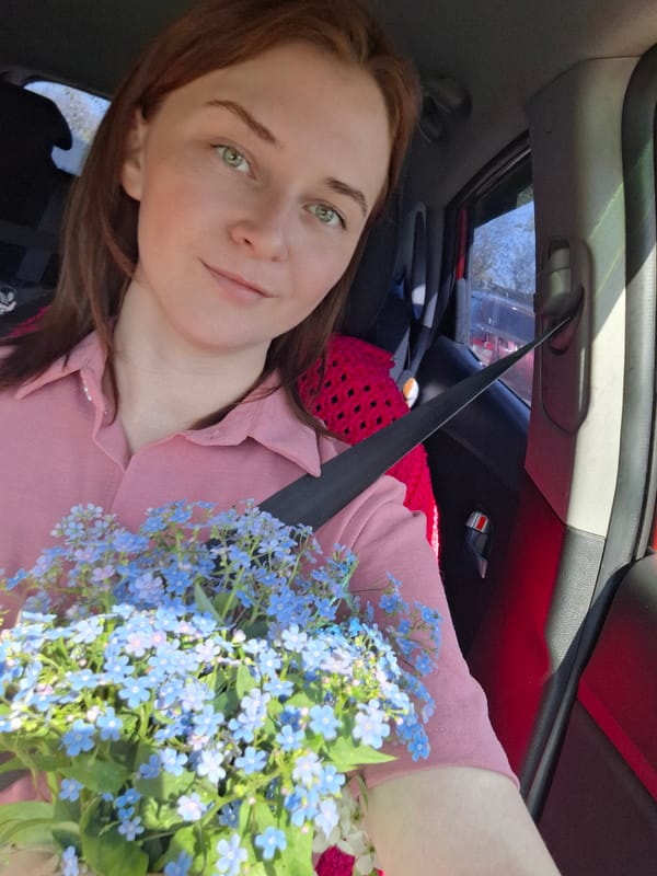Mother and baby enjoy spring garden morning in Chaikovsky