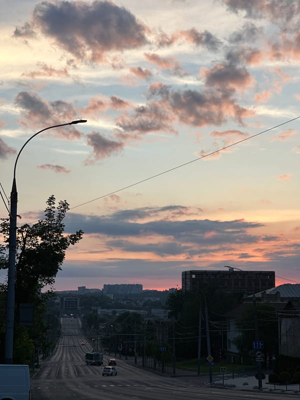 Sunset documented across Chișinău with pink clouds and urban skyline