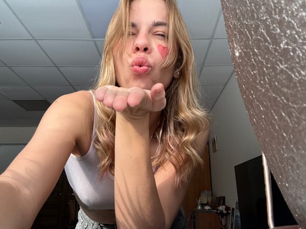 Woman poses with heart face paint in Ust-Ilimsk