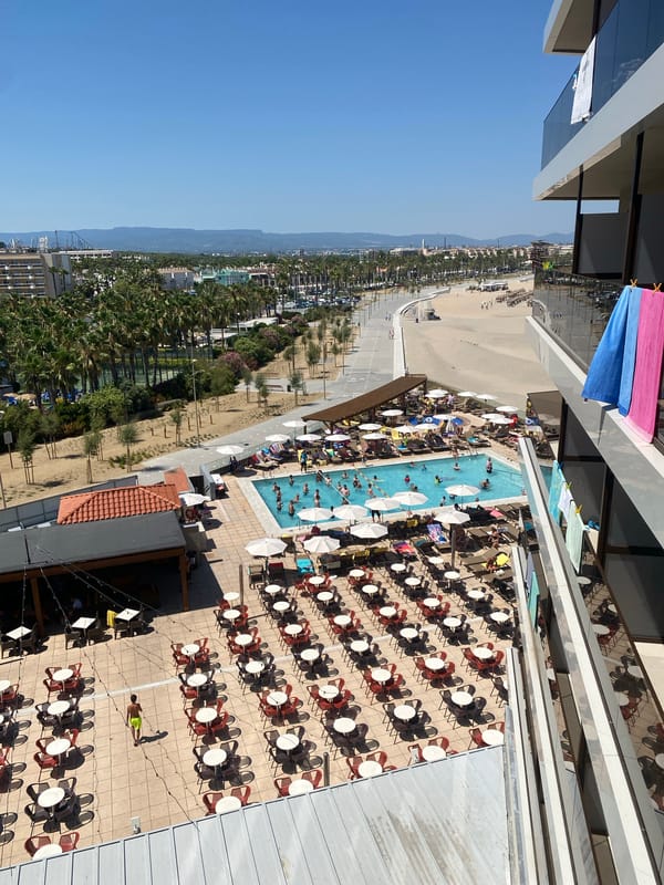 Gran Palas Hotel pool scene on a packed summer afternoon