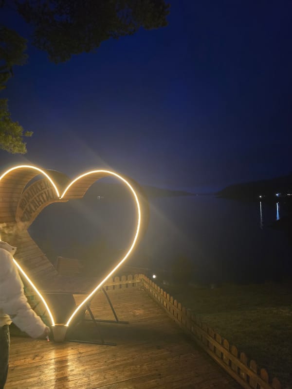 Illuminated heart monument glows in Sarnitsa Bulgaria evening
