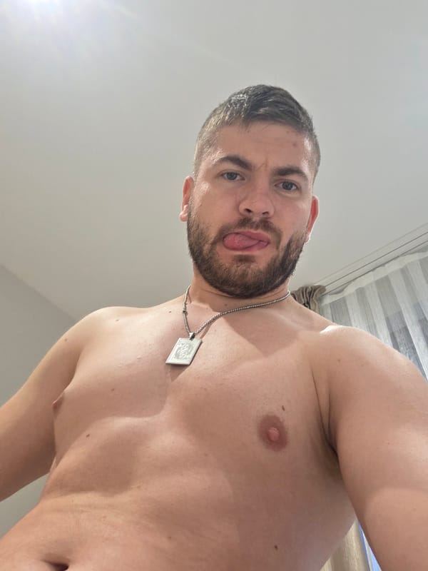 Man poses playfully for photos in Bulgarian home