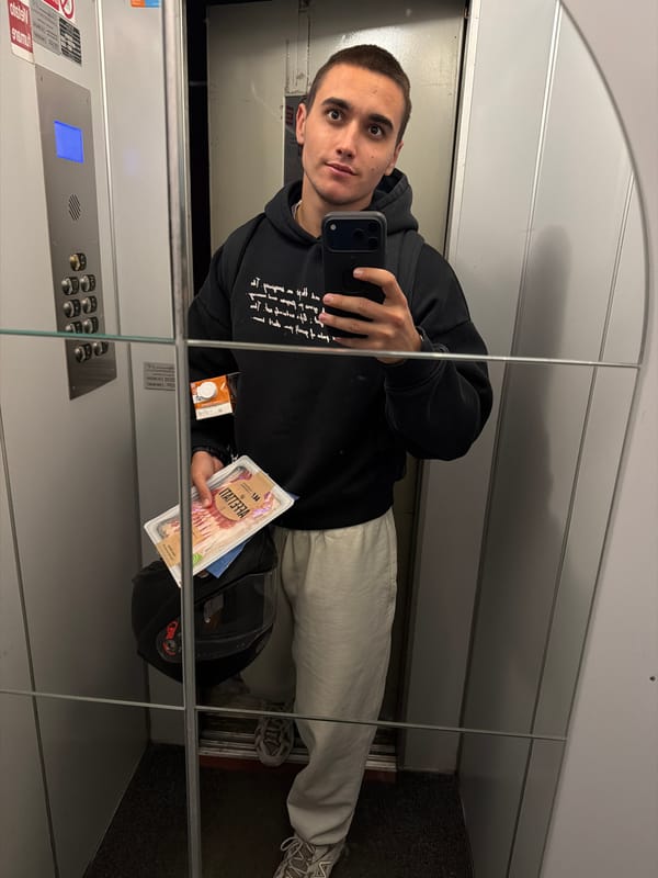 Man takes elevator selfie while holding bacon package in Milan