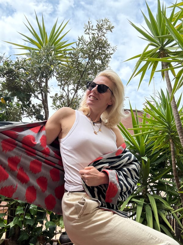 Woman poses for photos in patterned outfit in Rome