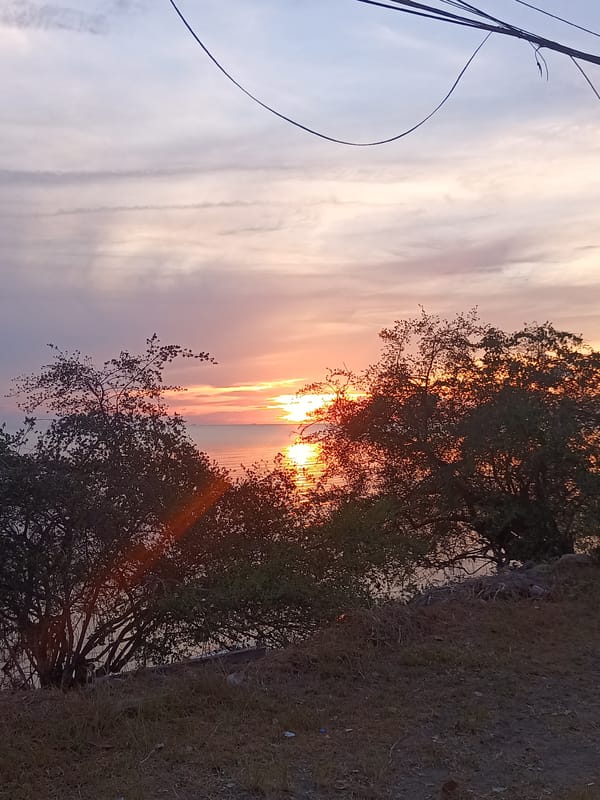Sunset photographed over water at Baan Sri Thanu, Thailand