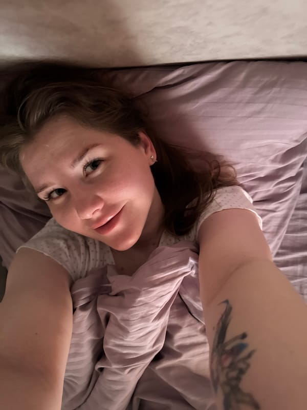 Woman rests on bed in Gornyi, Russia