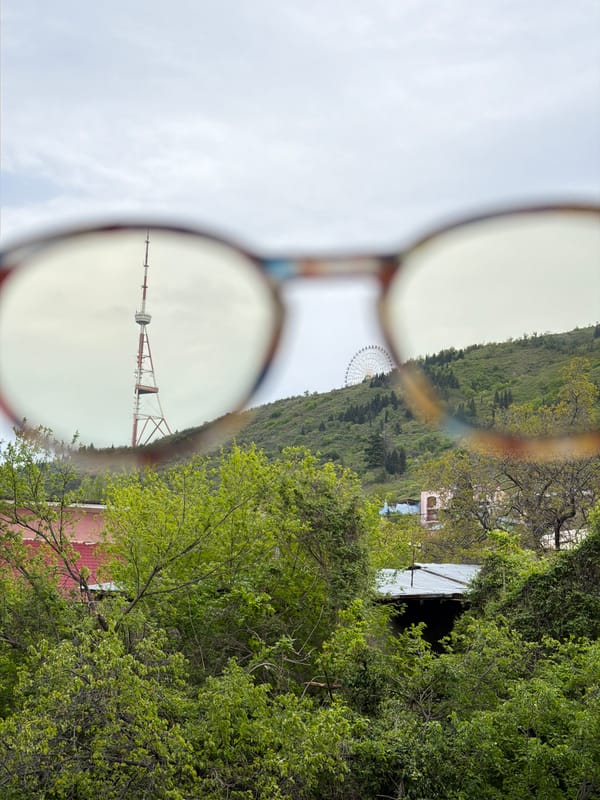 Tbilisi landmarks viewed through eyeglasses in morning POV challenge