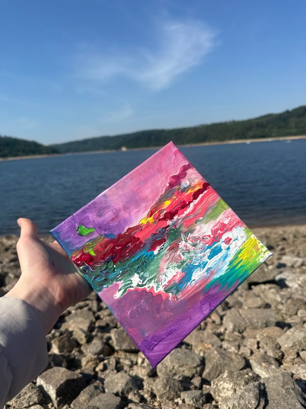 Abstract canvas held up against the Bohostice countryside
