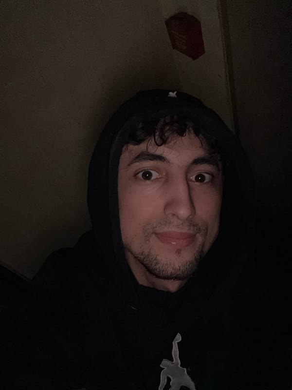 Afternoon selfie session in a black hoodie, indoors and out