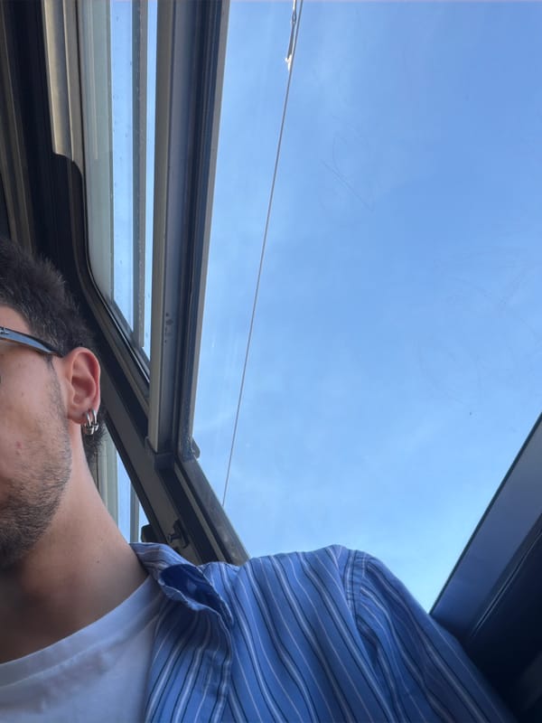 Person gazes at sky through sunroof in Milan