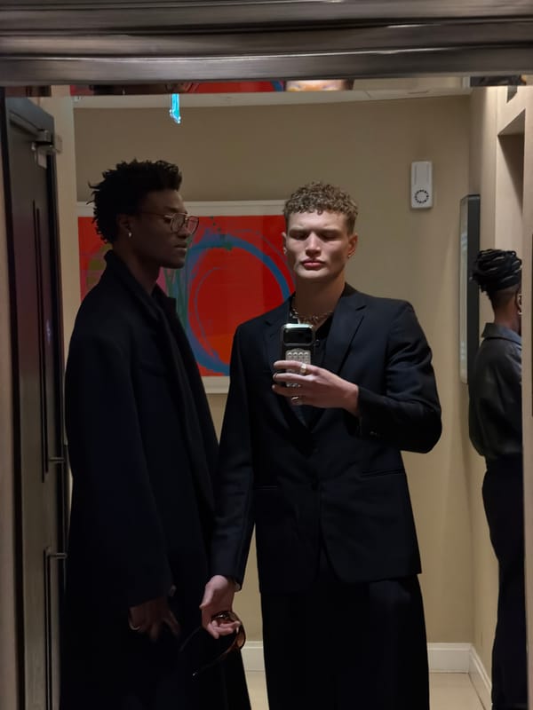 Three men take mirror selfies in London building