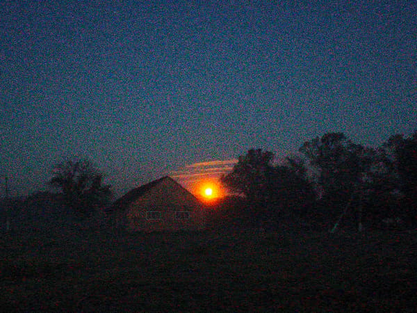 Evening documentation captures rural Ukraine village transition from twilight
