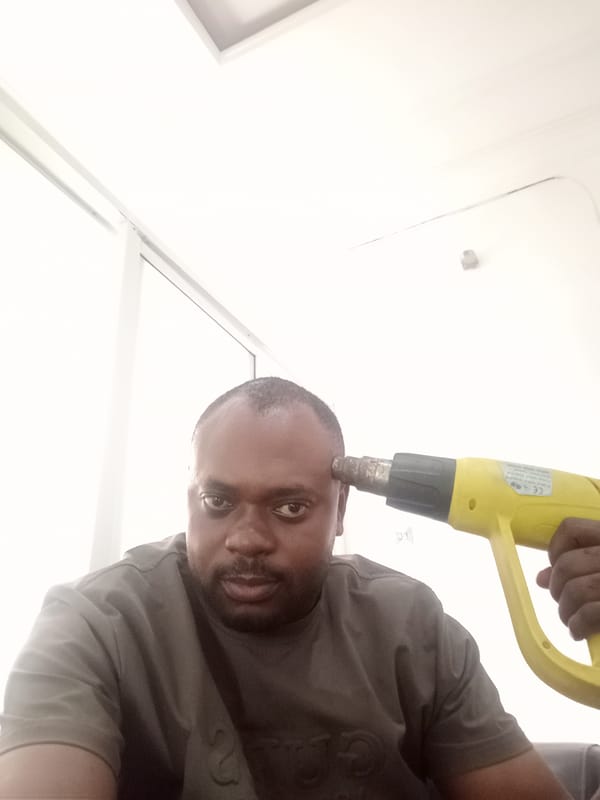 Man photographed in multiple indoor poses in Gwarinpa, Nigeria