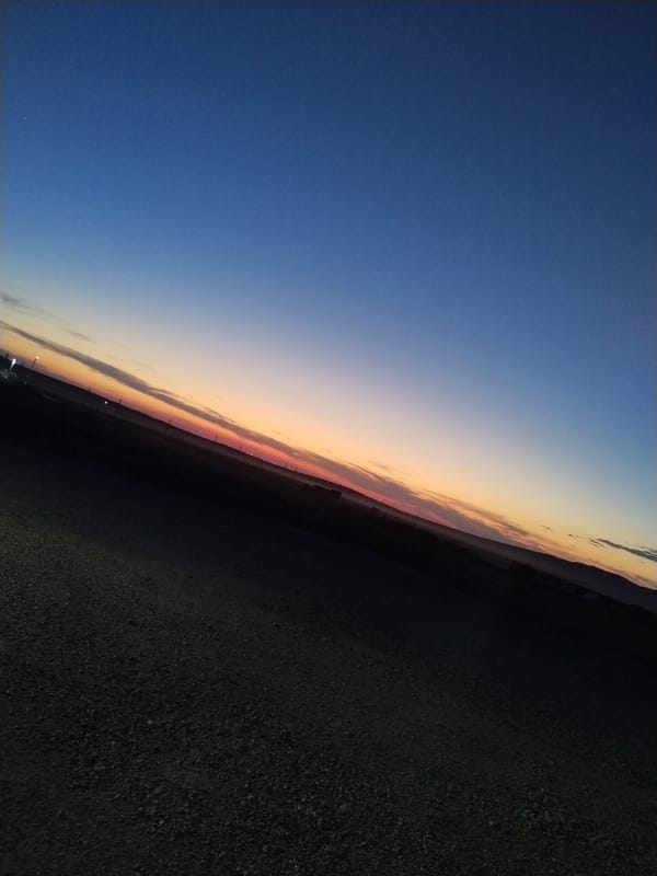 Dusk settles over an empty steppe road in rural Kazakhstan