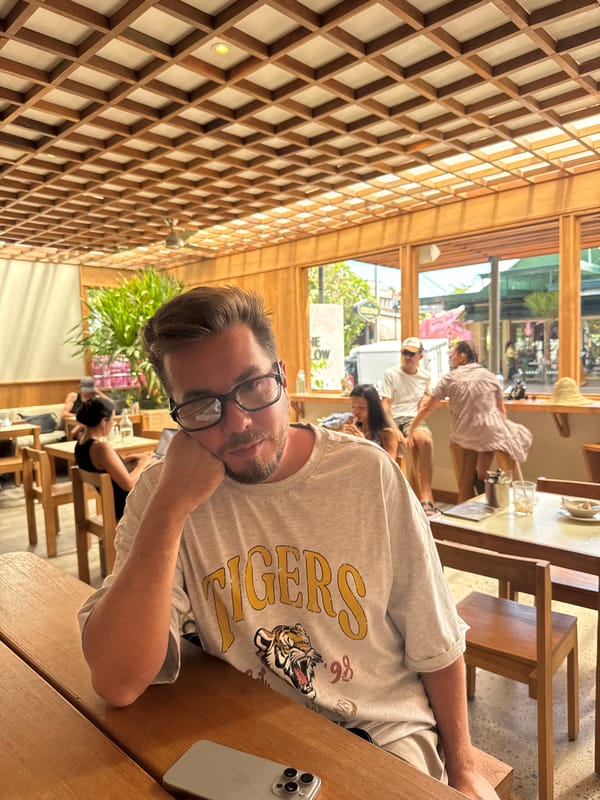 Man with glasses spotted dining at lattice-ceiling restaurant