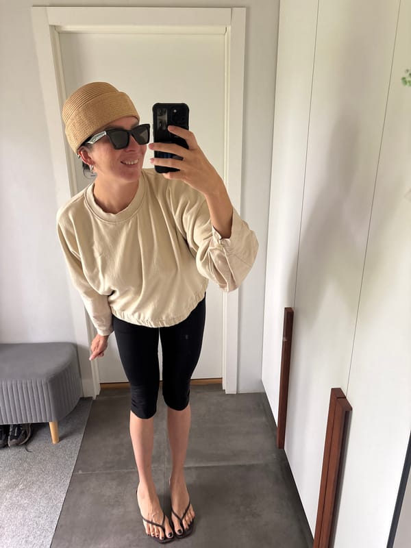 Woman takes mirror selfies with child in Chaikovsky home