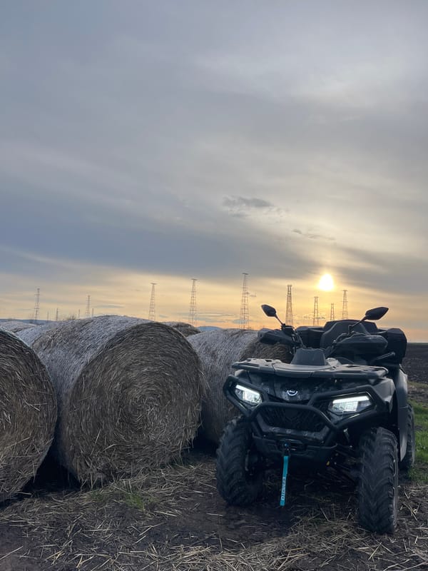 ATV parked among hay bales in Bulgarian field