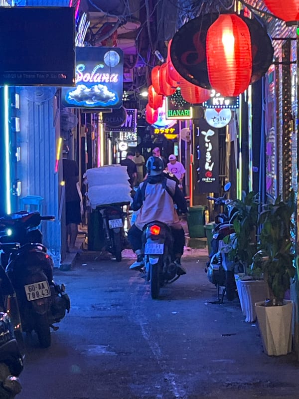 Evening street tour through Thủ Đức's neon-lit commercial district