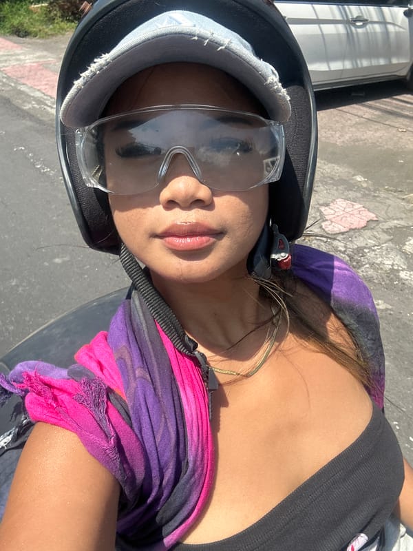 Scooter rider spotted on early morning Sukawati street