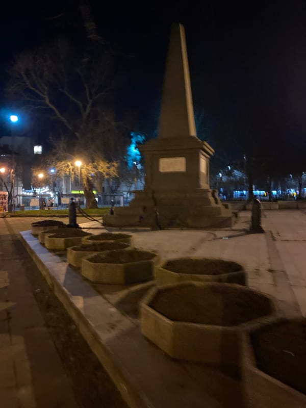Stone obelisk monument observed at night in Varna