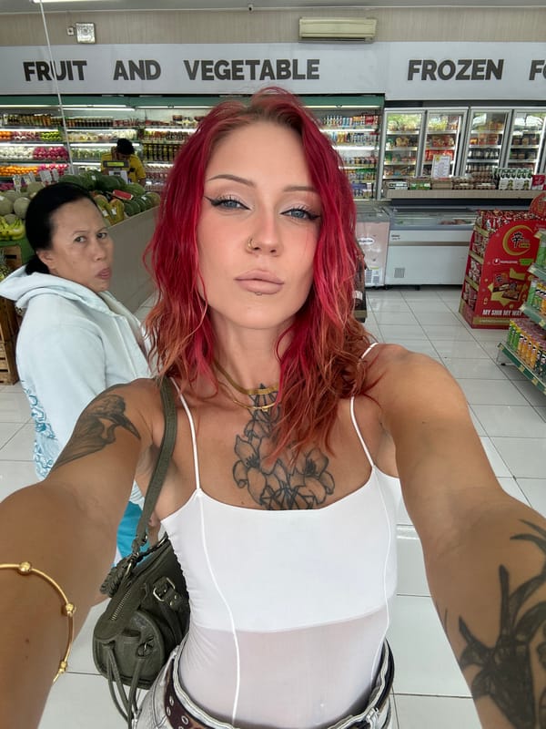 Woman takes selfies in Indonesian grocery store early morning