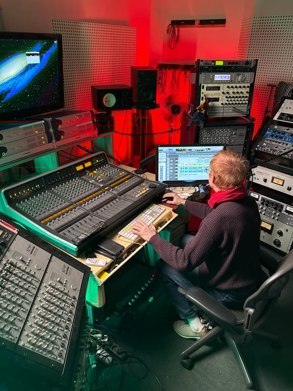 Audio engineer works at mixing console in Moscow studio