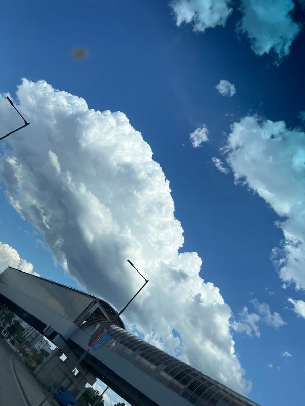 Dramatic cloud formations over urban streets and infrastructure