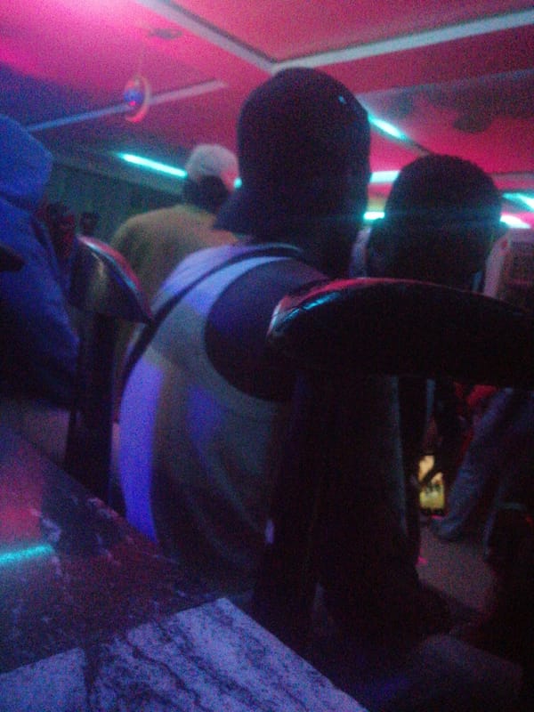 Late night social gathering documented at Jos entertainment venue