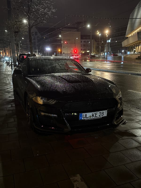 Sports car parked on wet street in Ulm