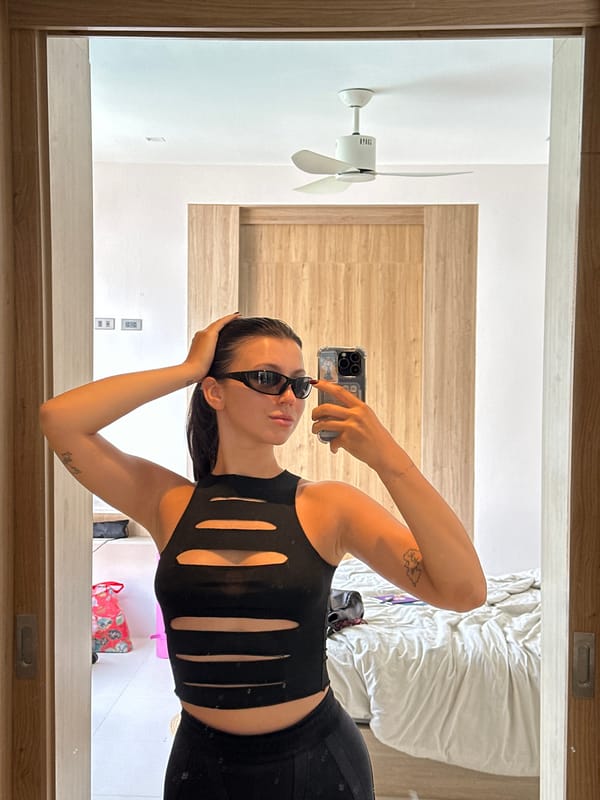 Hotel mirror selfie in Choeng Thale, full black outfit